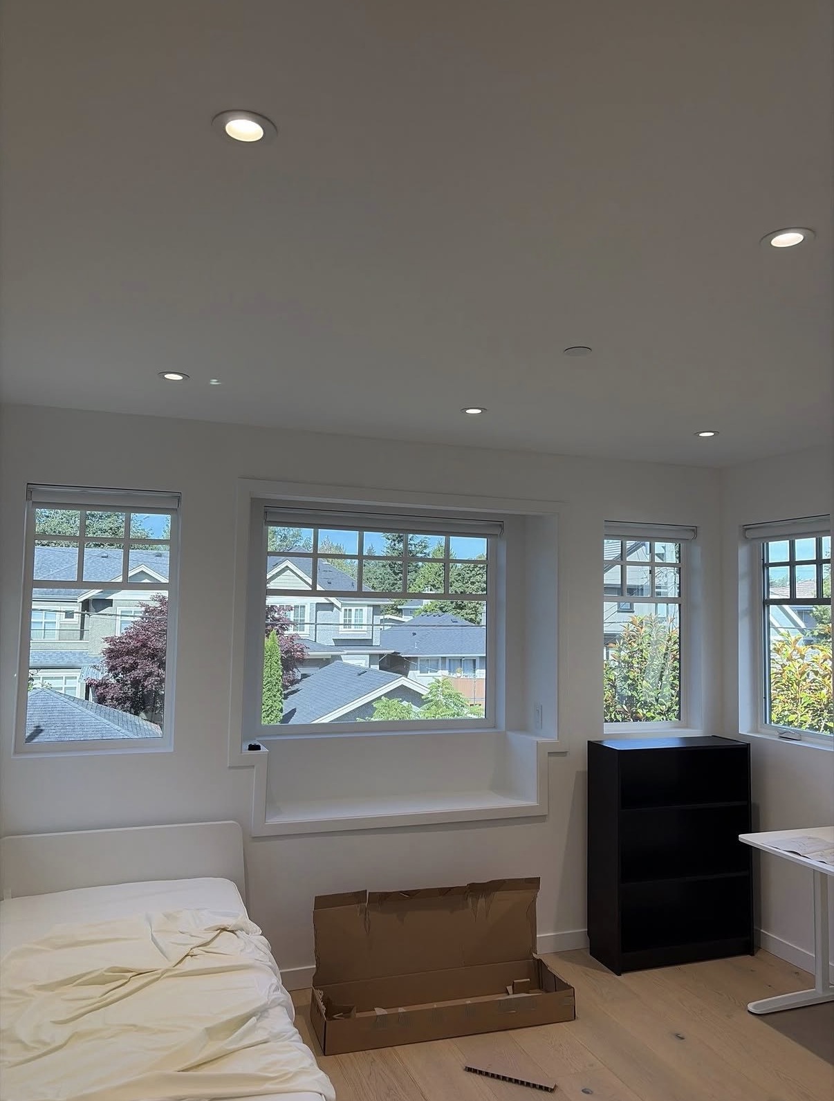 Recessed potlights installed in a bright Toronto bedroom