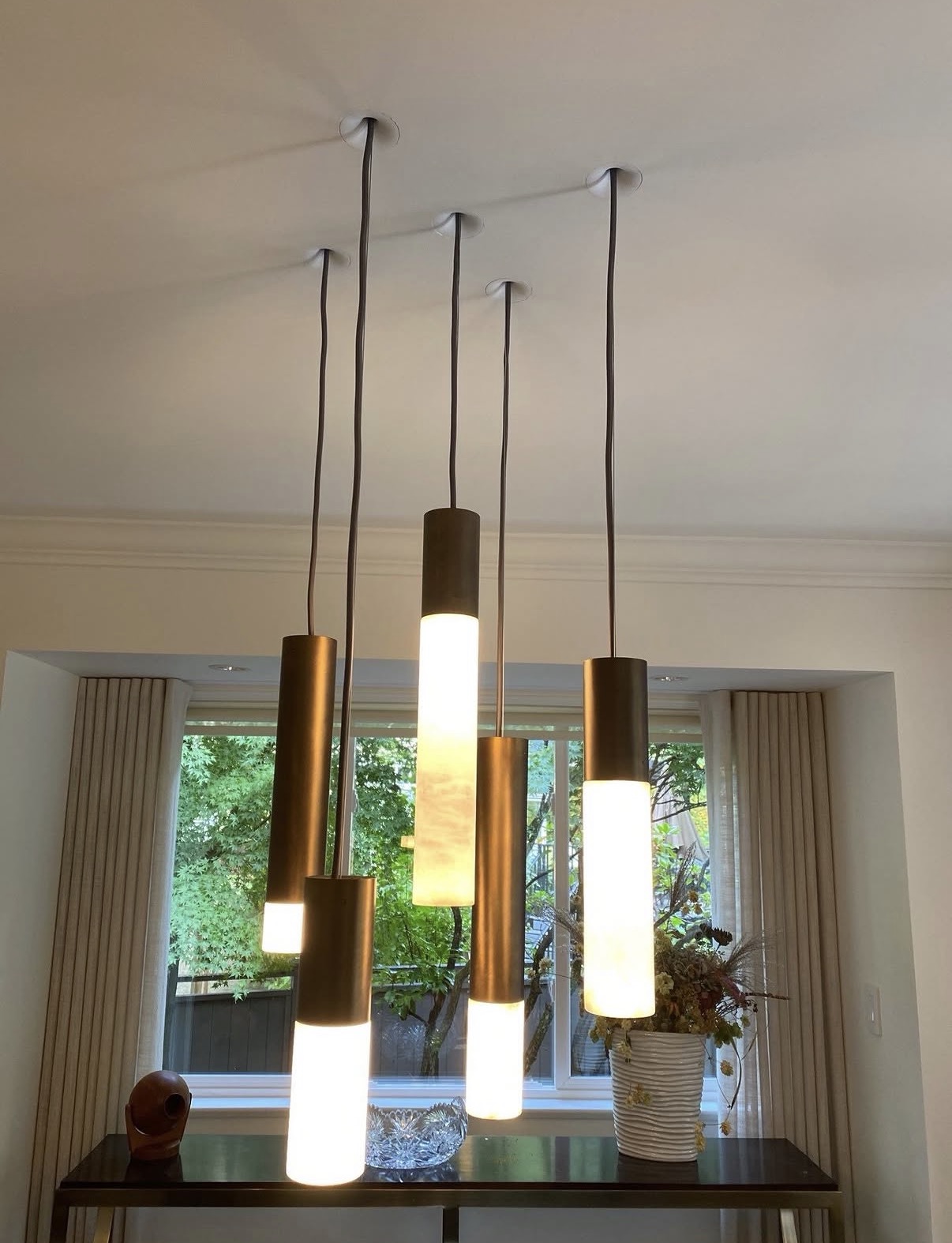 Installed pendant lighting over a Toronto home dining area
