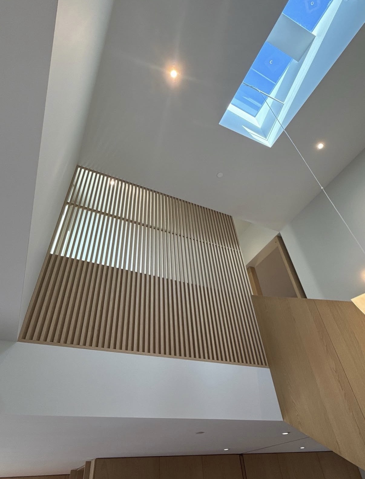 Electrical rough-in work visible in an open Toronto hallway ceiling